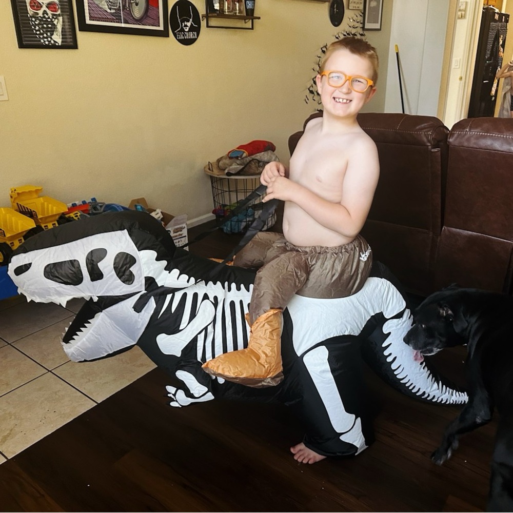 Kids “ride on” inflatable dinosaur skeleton costume